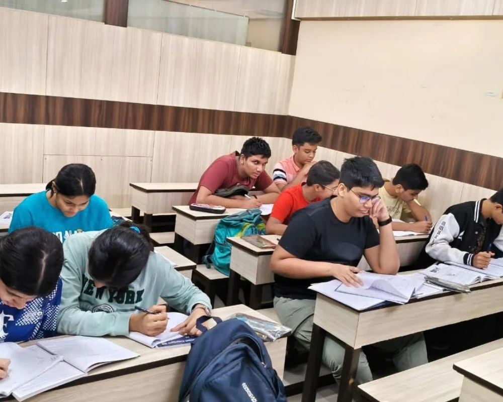 Class 12 CBSE students writing a test at Universal Tutorials, Navi Mumbai